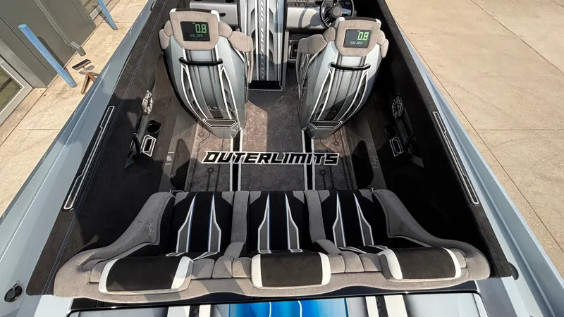 Slide: The Image of 2025 Outerlimits 50 SL Crypto II interior with sleek seating and modern dashboard design. - 16