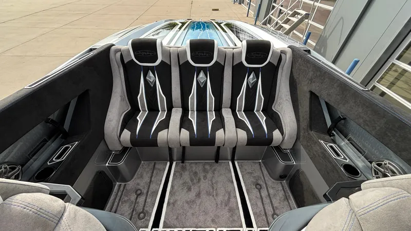 Slide: The Image of Interior of 2025 Outerlimits 50 SL Crypto II boat with luxurious seating and modern design. - 23