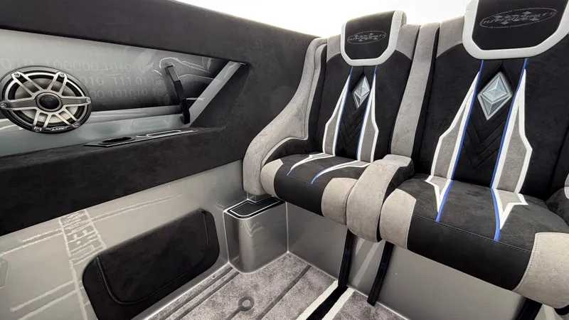 Slide: The Image of Interior of 2025 Outerlimits 50 SL Crypto II with stylish seats and speaker system. - 24