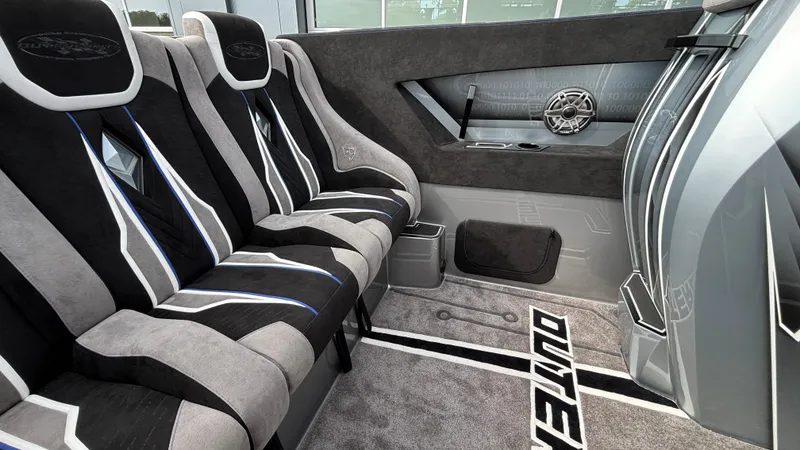 Slide: The Image of Interior of 2025 Outerlimits 50 SL Crypto II with sleek, modern seating and design. - 25