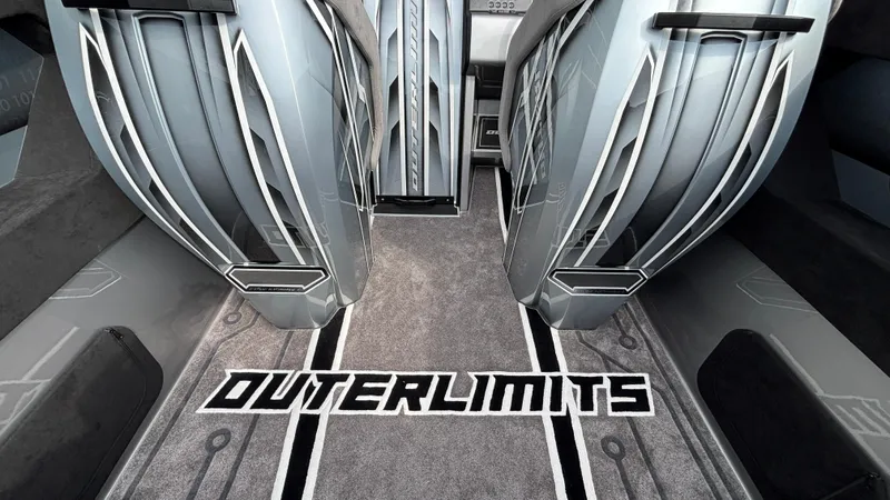 Slide: The Image of Interior of 2025 Outerlimits 50 SL Crypto II with sleek design and branded carpet. - 26