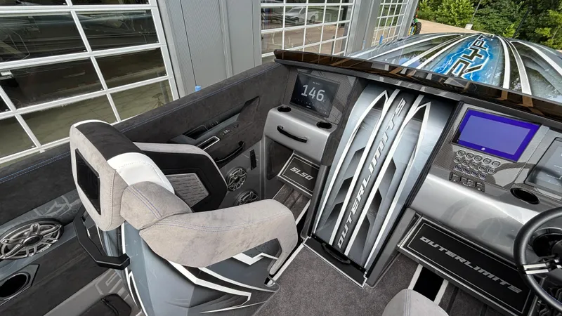Slide: The Image of Cockpit of 2025 Outerlimits 50 SL Crypto II with modern controls and sleek design. - 30
