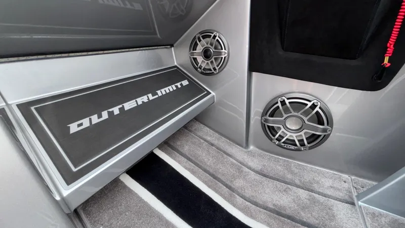 Slide: The Image of Interior of 2025 Outerlimits 50 SL Crypto II with speakers and branded flooring. - 34