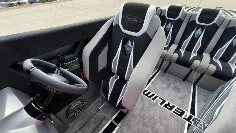 Slide: The Image of 2025 Outerlimits 50 SL Crypto II interior with sleek seating and modern steering wheel design. - 37