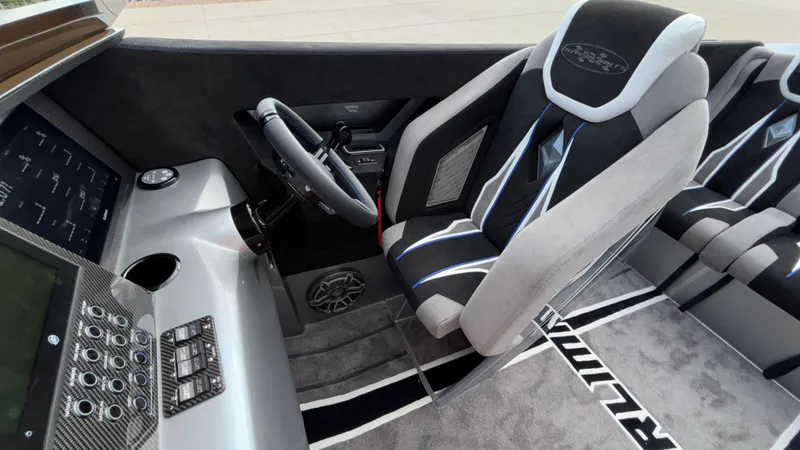 Slide: The Image of 2025 Outerlimits 50 SL Crypto II cockpit with modern steering and luxury seating. - 38