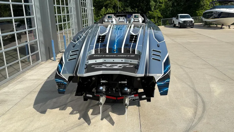 Slide: The Image of 2025 Outerlimits 50 SL Crypto II speedboat with sleek design and vibrant graphics. - 4