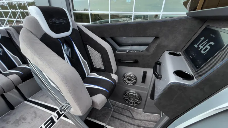 Slide: The Image of Interior of 2025 Outerlimits 50 SL Crypto II with modern seating and digital display. - 42