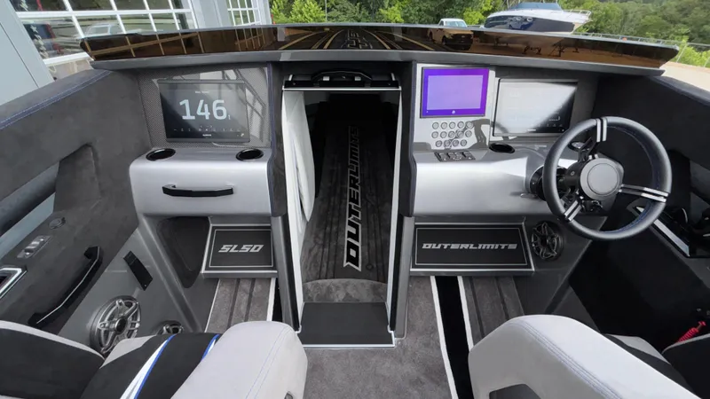 Slide: The Image of Cockpit of 2025 Outerlimits 50 SL Crypto II with modern controls and displays. - 45
