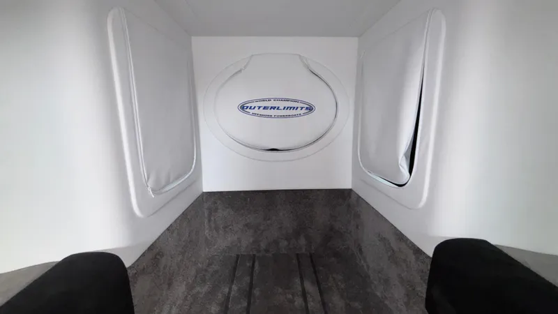 Slide: The Image of Interior of 2025 Outerlimits 50 SL Crypto II boat, featuring sleek white design. - 49