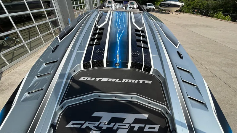 Slide: The Image of 2025 Outerlimits 50 SL Crypto II speedboat with sleek design and striking graphics. - 9