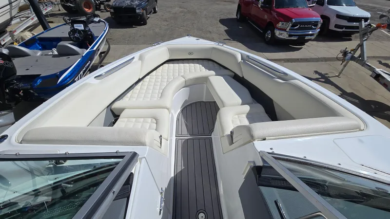 Slide: The Image of 2017 Cobalt R5 WSS Surf boat with spacious white seating and sleek design. - 12