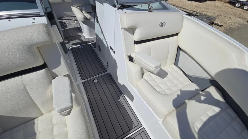 Slide: The Image of 2017 Cobalt R5 WSS Surf boat interior with white leather seating and sleek flooring. - 13