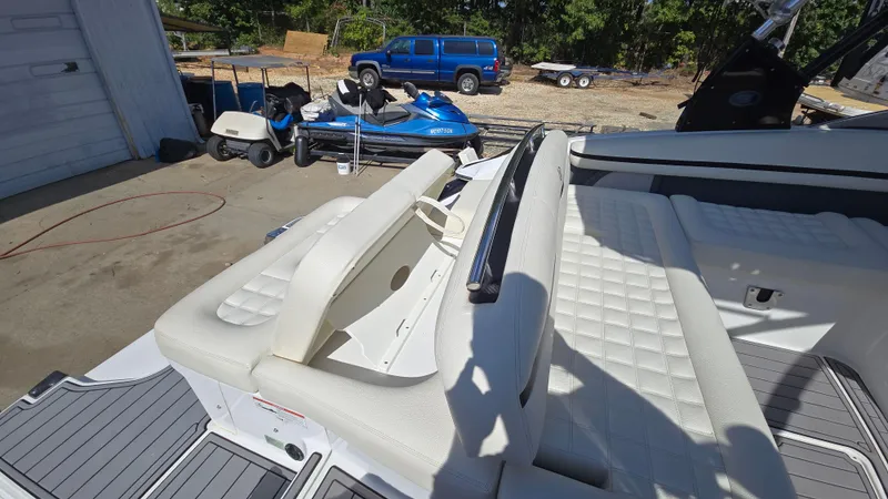 Slide: The Image of 2017 Cobalt R5 WSS Surf boat interior with white seating and deck view. - 21