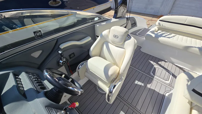 Slide: The Image of Interior of 2017 Cobalt R5 WSS Surf boat with white seating and sleek dashboard. - 22
