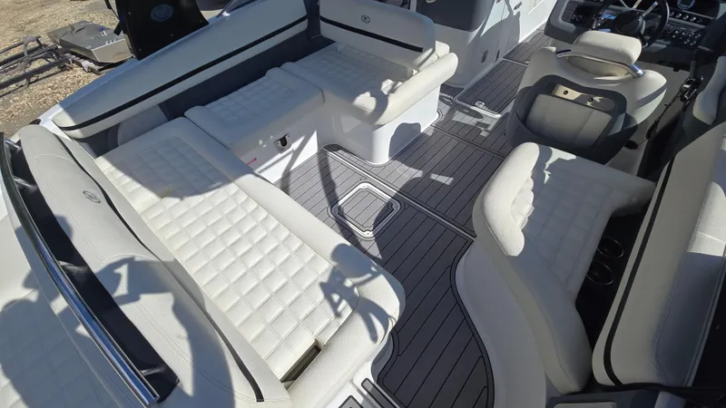 Slide: The Image of 2017 Cobalt R5 WSS Surf boat interior with white cushioned seating and sleek design. - 23