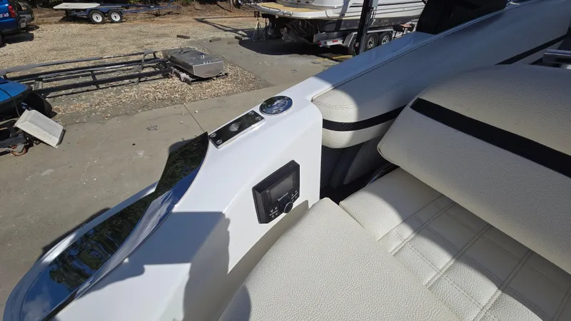 Slide: The Image of 2017 Cobalt R5 WSS Surf boat interior with white seating and control panel. - 24