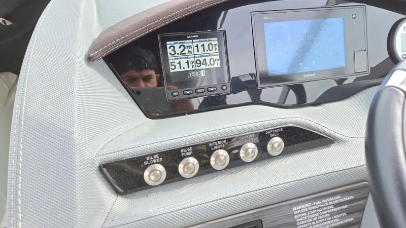 Slide: The Image of Dashboard of a 2017 Cobalt R5 WSS Surf boat with Garmin displays and control switches. - 29