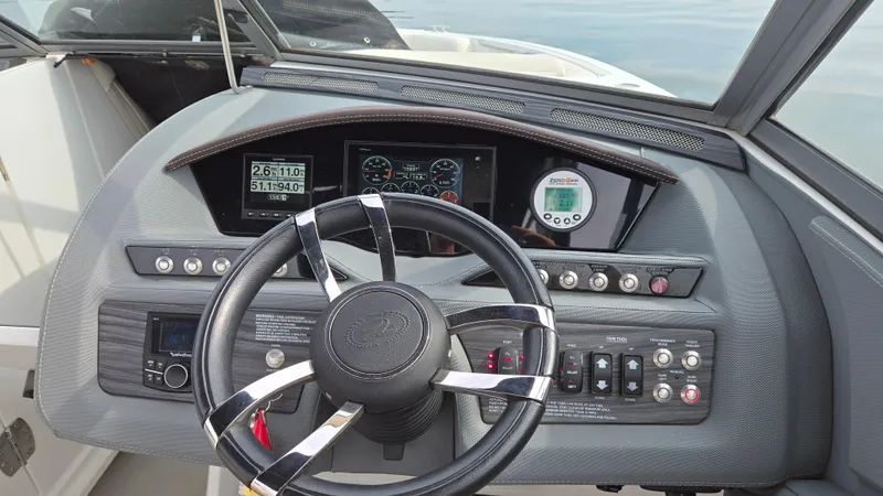 Slide: The Image of 2017 Cobalt R5 WSS Surf boat dashboard with steering wheel and control panels. - 30