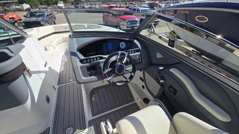 Slide: The Image of 2017 Cobalt R5 WSS Surf boat interior with steering wheel and dashboard controls. - 37