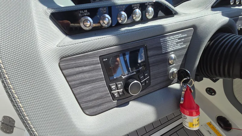 Slide: The Image of 2017 Cobalt R5 WSS Surf dashboard with control panel and ignition keys. - 40