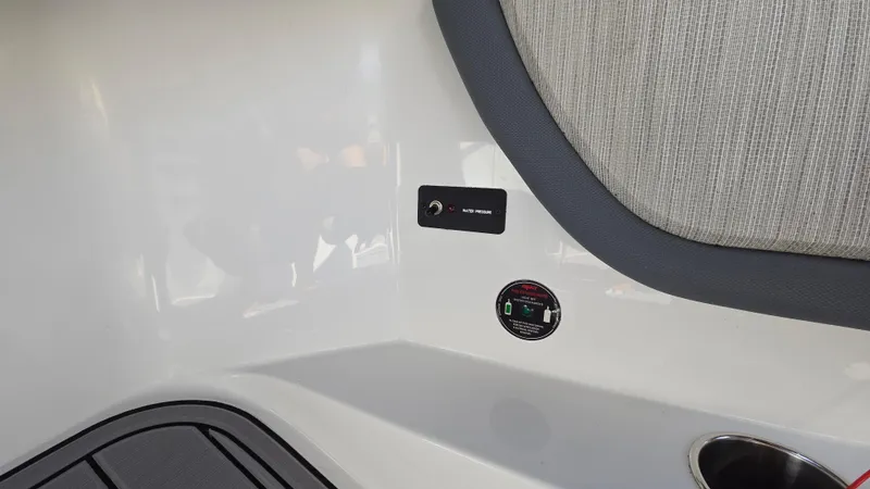 Slide: The Image of Interior detail of 2017 Cobalt R5 WSS Surf boat, featuring control panel and upholstery. - 43