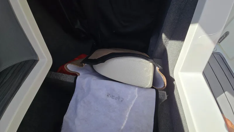 Slide: The Image of Interior view of a 2017 Cobalt R5 WSS Surf boat storage compartment. - 45