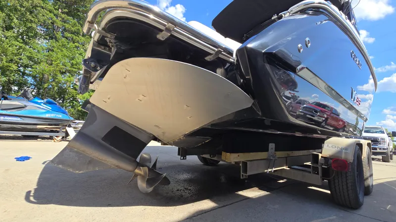 Slide: The Image of 2017 Cobalt R5 WSS Surf boat on trailer, rear view with propeller and shiny hull. - 5