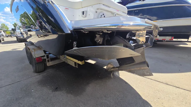 Slide: The Image of 2017 Cobalt R5 WSS Surf boat on trailer, rear view showing propeller and hull. - 6