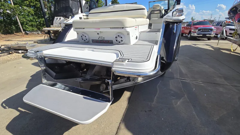 Slide: The Image of 2017 Cobalt R5 WSS Surf boat with swim platform, parked outdoors. - 7