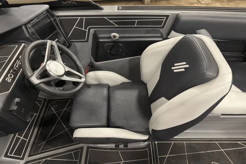 Slide: The Image of 2021 ATX Surf Boats 20 Type-S interior with steering wheel and seating. - 12