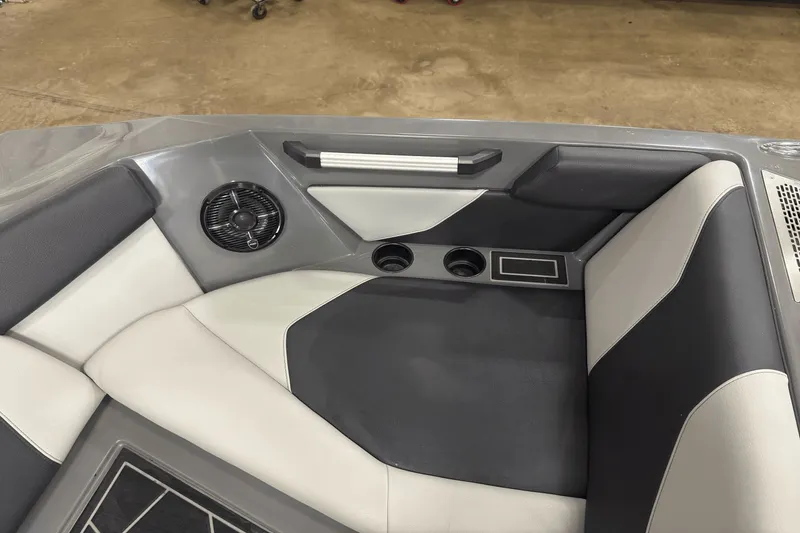Slide: The Image of 2021 ATX Surf Boats 20 Type-S interior seating with cup holders and speaker. - 19