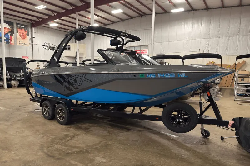 Slide: The Image of 2021 ATX Surf Boats 20 Type-S on trailer in indoor showroom. - 2
