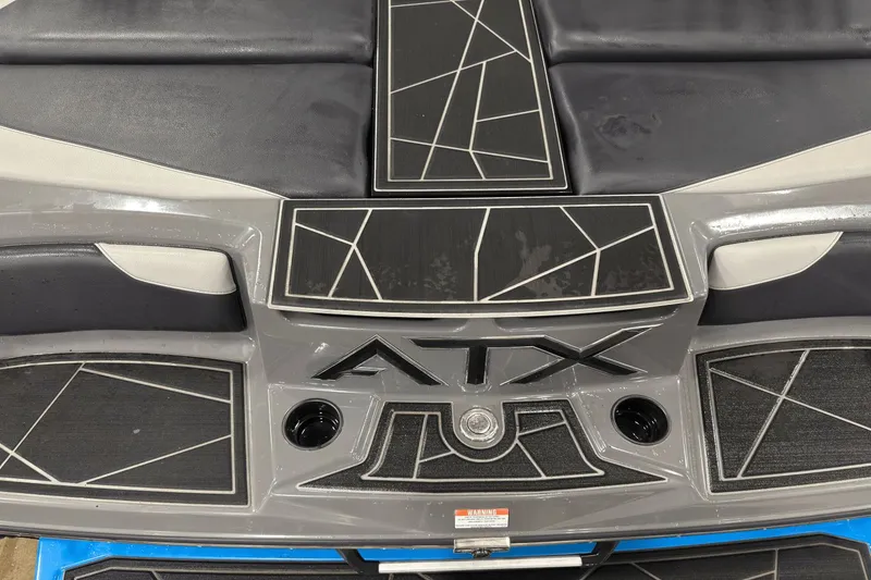 Slide: The Image of 2021 ATX Surf Boats 20 Type-S, rear deck with geometric design and logo. - 23