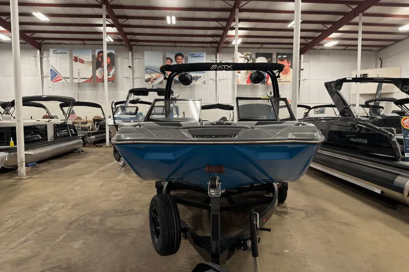 Slide: The Image of 2021 ATX Surf Boats 20 Type-S in showroom, blue exterior, front view. - 3