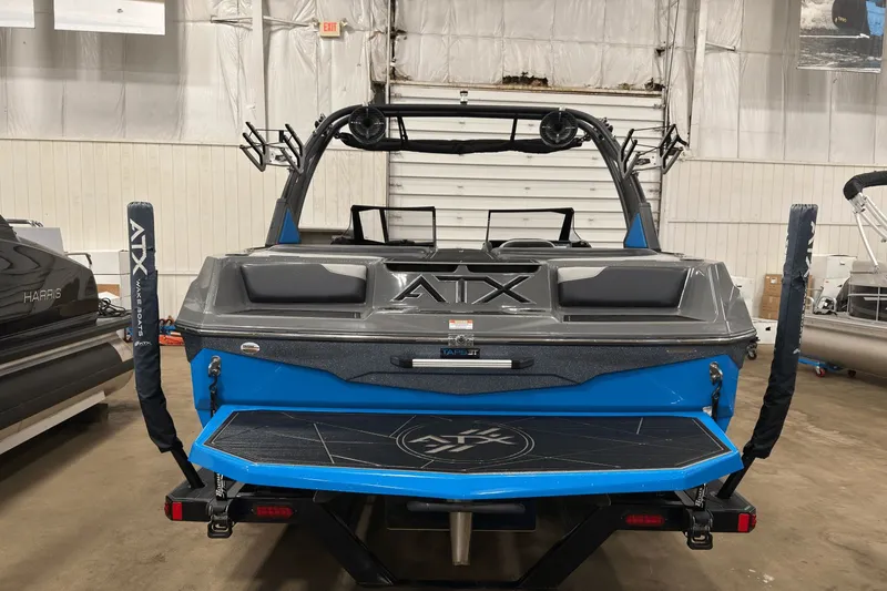 Slide: The Image of 2021 ATX Surf Boats 20 Type-S in a showroom, rear view with blue accents. - 4