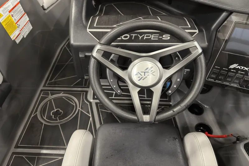 Slide: The Image of 2021 ATX Surf Boats 20 Type-S steering wheel and dashboard interior. - 8