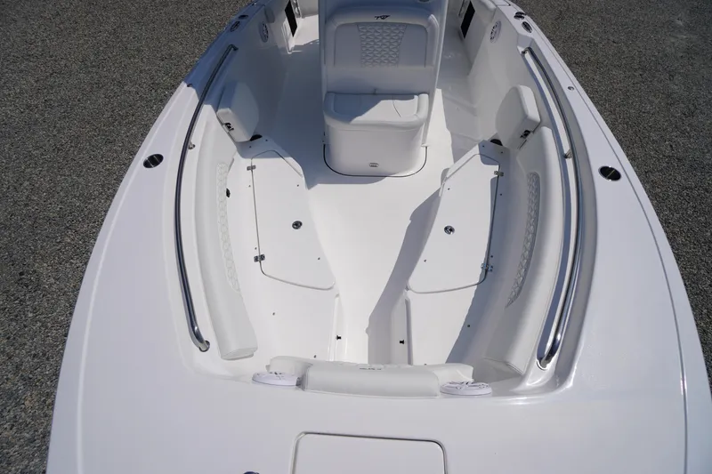Slide: The Image of 2026 Tidewater 232 CC Adventure boat interior with seating and storage compartments. - 16