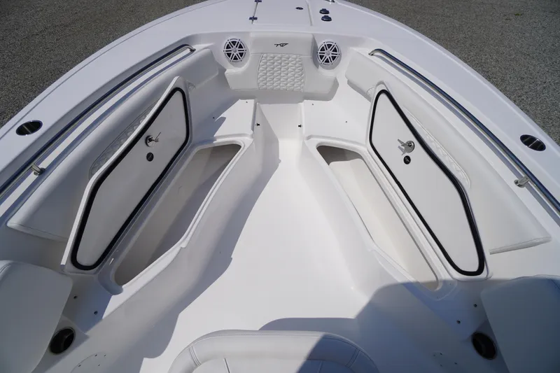Slide: The Image of 2026 Tidewater 232 CC Adventure boat interior with storage compartments and seating. - 19