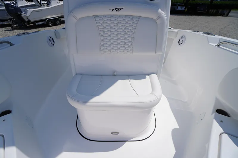 Slide: The Image of 2026 Tidewater 232 CC Adventure boat seat with white upholstery and geometric design. - 20