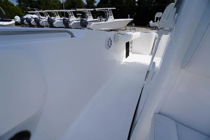 Slide: The Image of 2026 Tidewater 232 CC Adventure boat interior, showcasing sleek white design and spacious layout. - 24