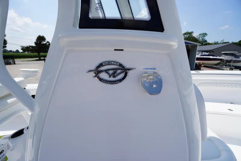 Slide: The Image of 2026 Tidewater 232 CC Adventure boat with fresh water access feature. - 25