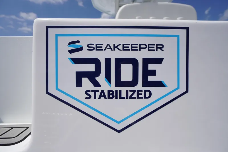 Slide: The Image of Tidewater 232 CC Adventure 2026 with Seakeeper Ride Stabilized logo. - 3