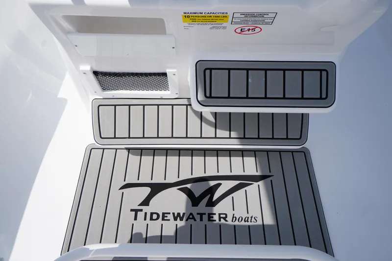 Slide: The Image of Tidewater 232 CC Adventure 2026 boat deck with logo and capacity label. - 36