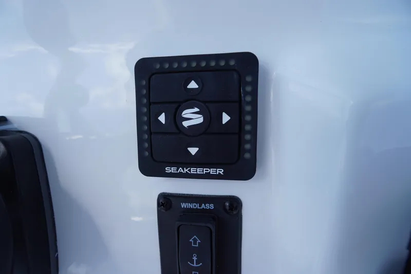 Slide: The Image of Control panel on 2026 Tidewater 232 CC Adventure boat featuring Seakeeper and windlass controls. - 38