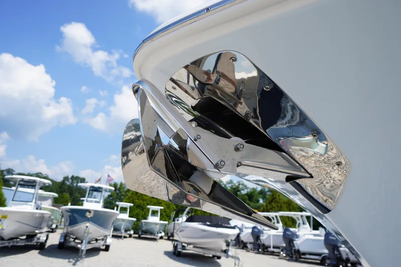 Slide: The Image of 2026 Tidewater 232 CC Adventure boat with stainless steel anchor, displayed outdoors under blue sky. - 4