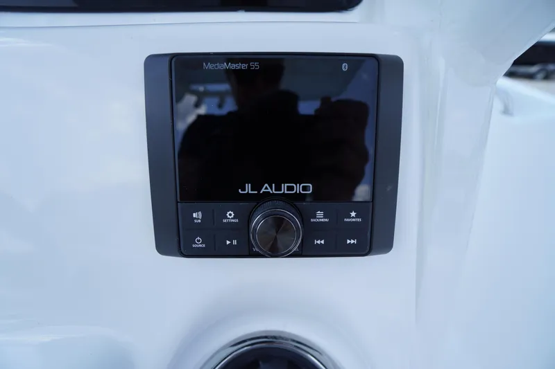 Slide: The Image of JL Audio MediaMaster 55 on 2026 Tidewater 232 CC Adventure boat dashboard. - 40