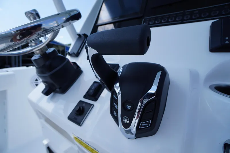 Slide: The Image of Close-up of 2026 Tidewater 232 CC Adventure boat controls and steering wheel. - 41