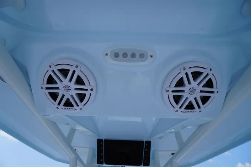 Slide: The Image of 2026 Tidewater 232 CC Adventure boat speakers and lighting on the ceiling. - 45