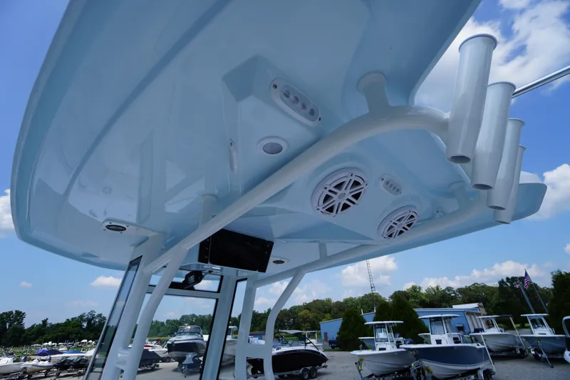 Slide: The Image of 2026 Tidewater 232 CC Adventure boat with speakers and rod holders, viewed from below. - 47