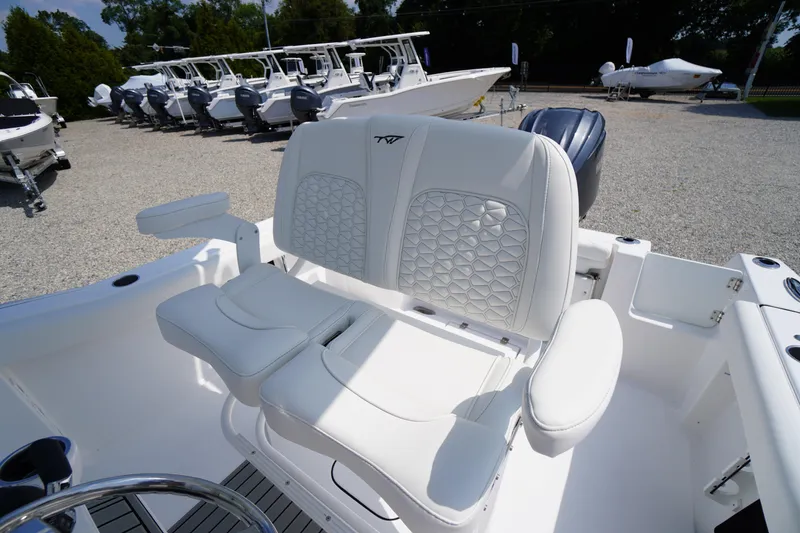 Slide: The Image of 2026 Tidewater 232 CC Adventure boat with luxurious white seating and modern design. - 48